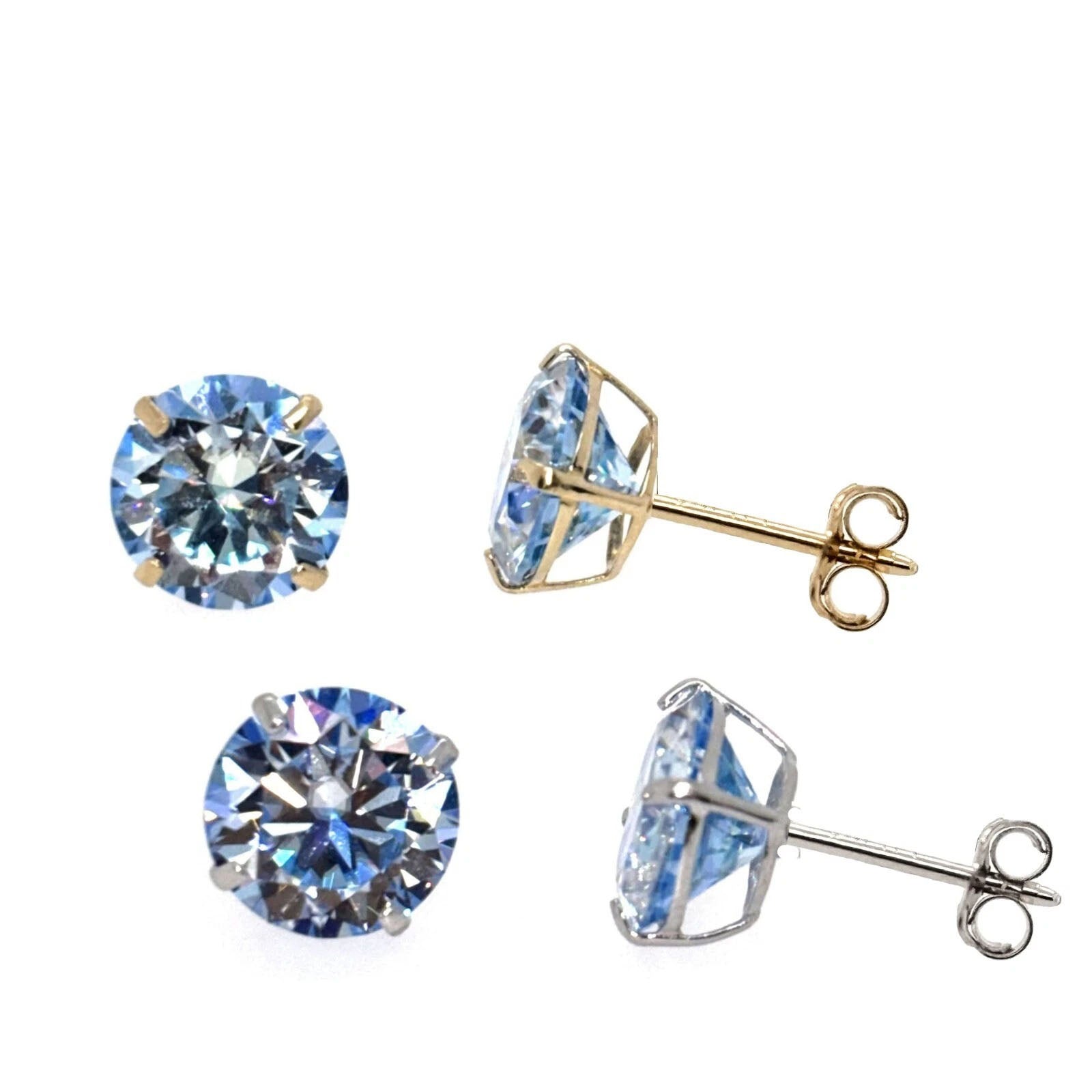 Set of blue gemstone earrings with gold and silver settings on a white background
